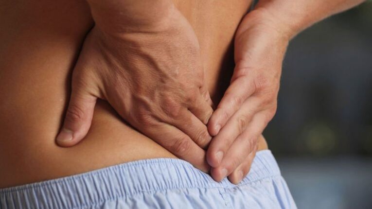 Discomfort in the lower back due to lumbar osteoarthritis